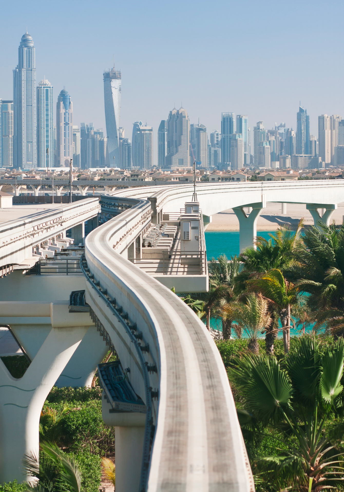 Dubai skyline with monorail and palm trees