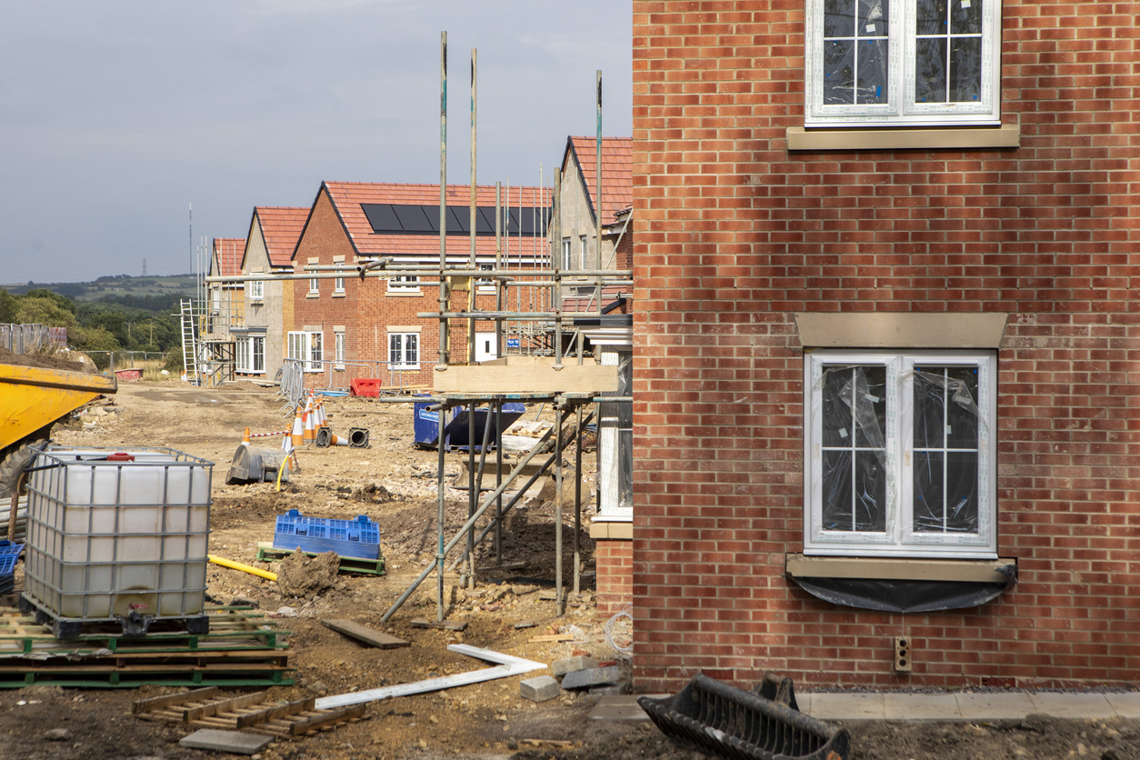 New housing development construction site with brick homes