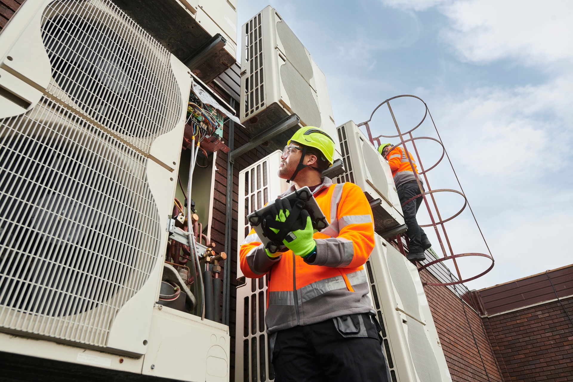 HVAC technicians maintaining building systems